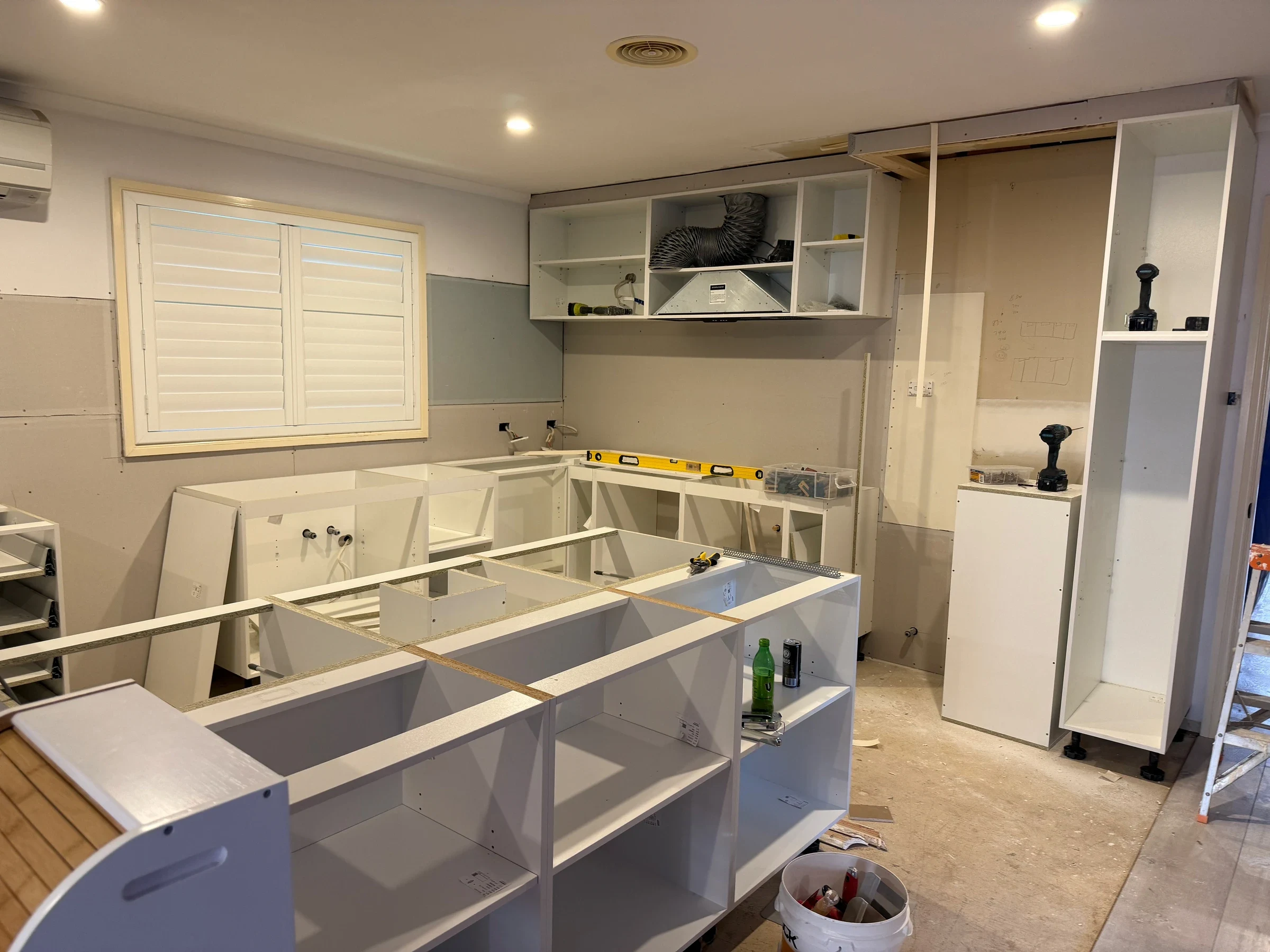 The same kitchen during cabinet and island installation