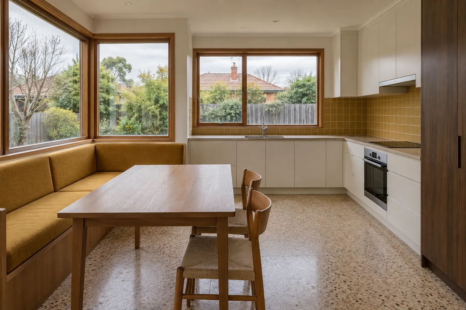 An ochre dining nook beside the kitchen — kitchen design inspiration