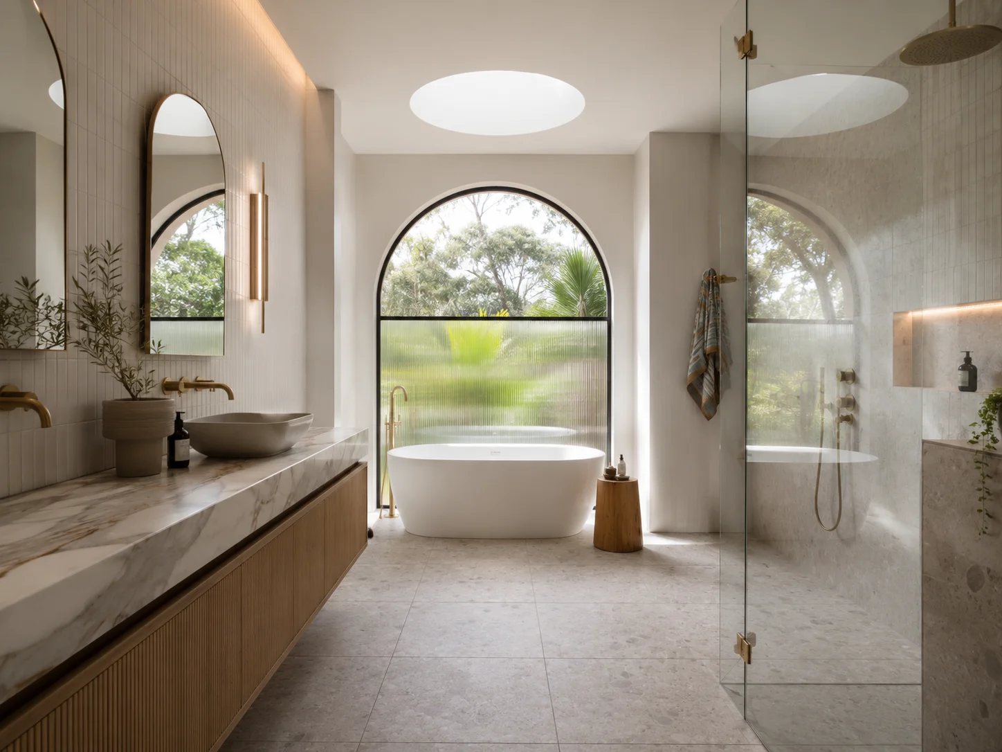 Bathroom inspiration with a freestanding bath and an arched window